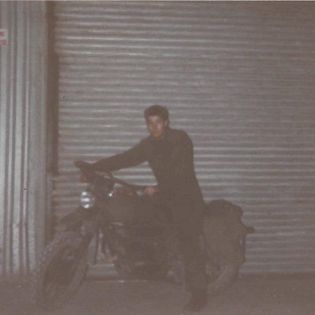 Brett Portman REME Falklands 1986 riding a motorbike