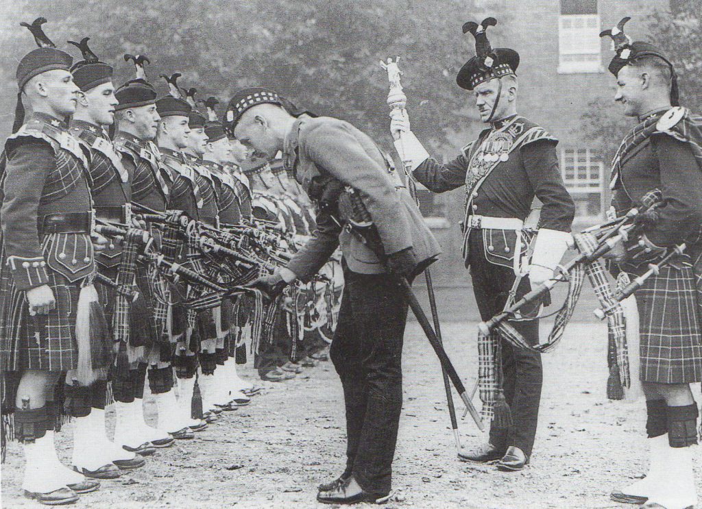 Magnificent Military Musicians 1 A black and white picture of bandsmen from the Royal Scots Fusiliers being inspected by an officer under the watchful eye of the Pipe Major