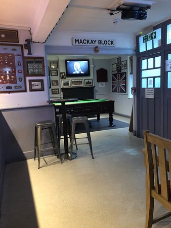 Powerful Part 6 Orders - Date for your diary 7 A photograph of the inside of the Trafalgar public house in Aldershot showing the pool table are and various memorabilia and pictures of the parachute regiment and its soldiers in action