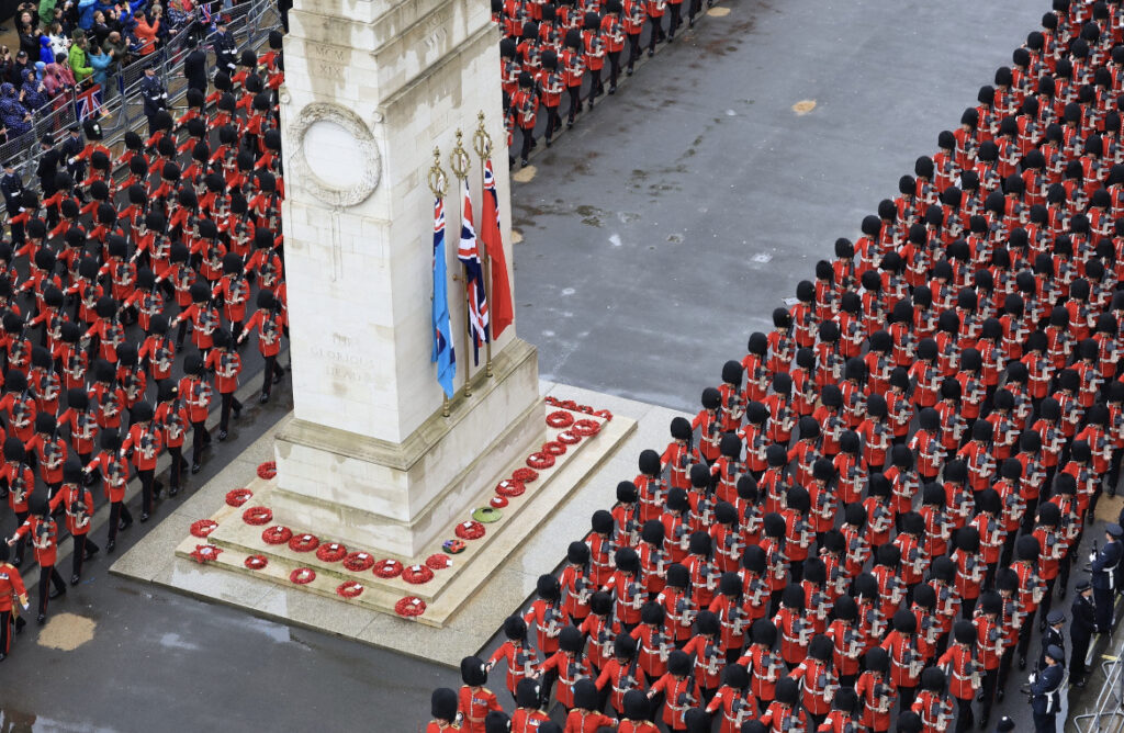 The Majestic and Sensational Coronation in Pictures - GSTK 18 Guardsmen in their red tunics and bearskins either side of the cenotaph